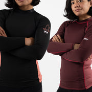 Two individuals wearing black and maroon athletic shirts with logos on a white background
